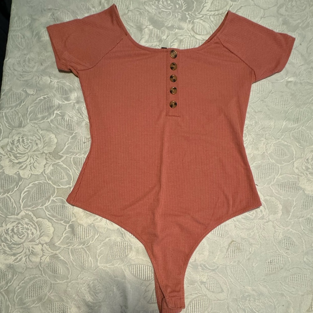 Orange body suit